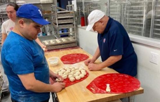 Michael Krygier General Mills’ Doughminator works with cadets at Rockin’ Baker Academy.