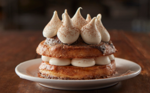 Cinnamon French toast rounds topped with dollops of mascarpone whipped cream.